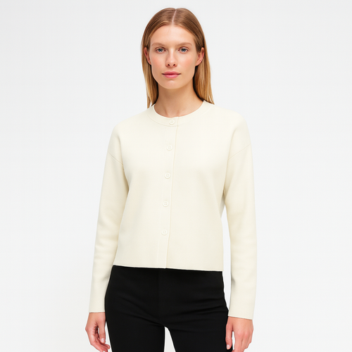 Knit cardigan with a round neckline, long sleeves, and a front button closure.