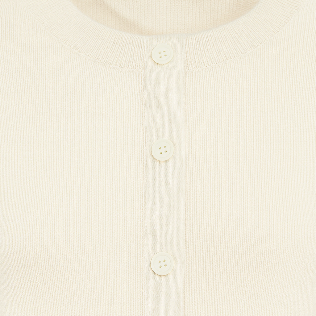 Knit cardigan with a round neckline, long sleeves, and a front button closure.