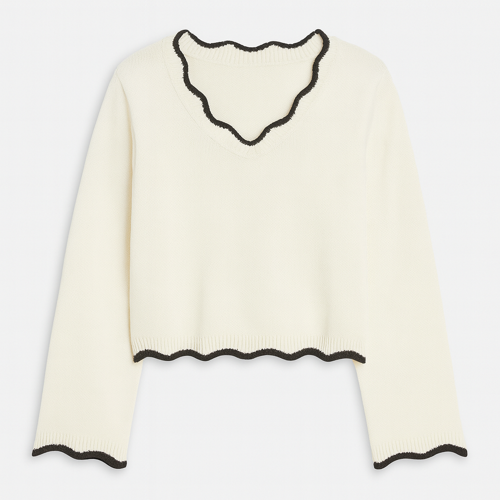 Long-sleeve knit sweater with a scalloped V-neckline, scalloped hem, and scalloped cuffs.