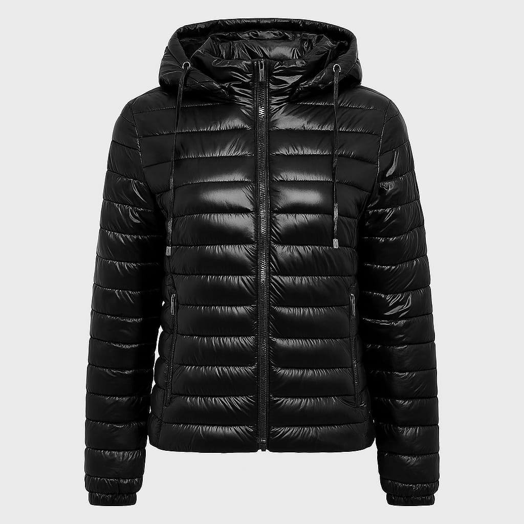 A quilted puffer jacket with a front zipper closure, two side pockets, long sleeves, and an attached hood with drawstrings.